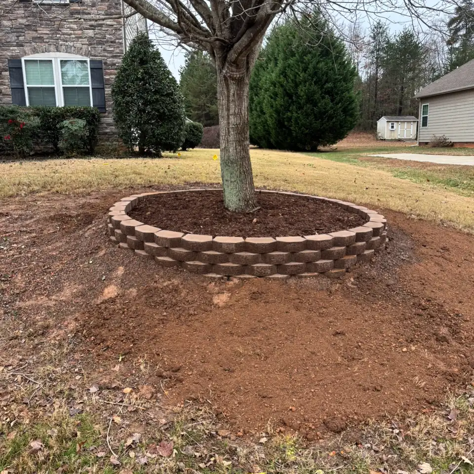 The finished block tree ring with mulch, set on the crushed stone base