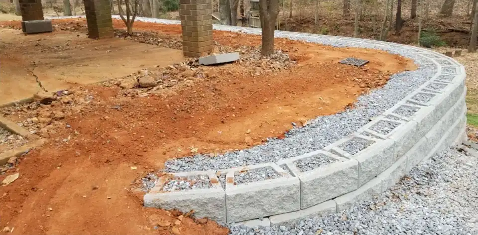 The same wall during the build, with crushed stone behind it