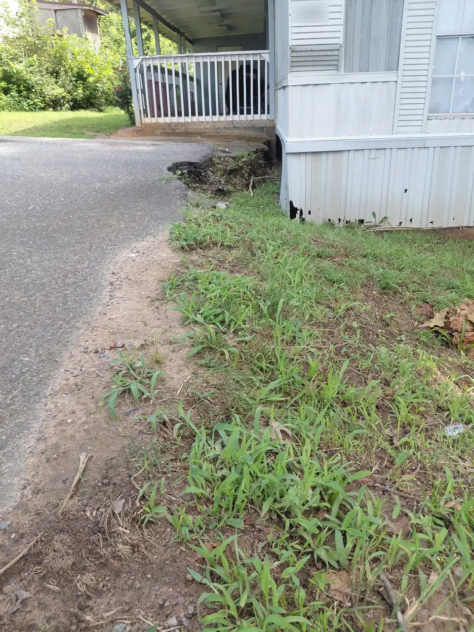 Before: washed-out driveway edge in Dallas, NC