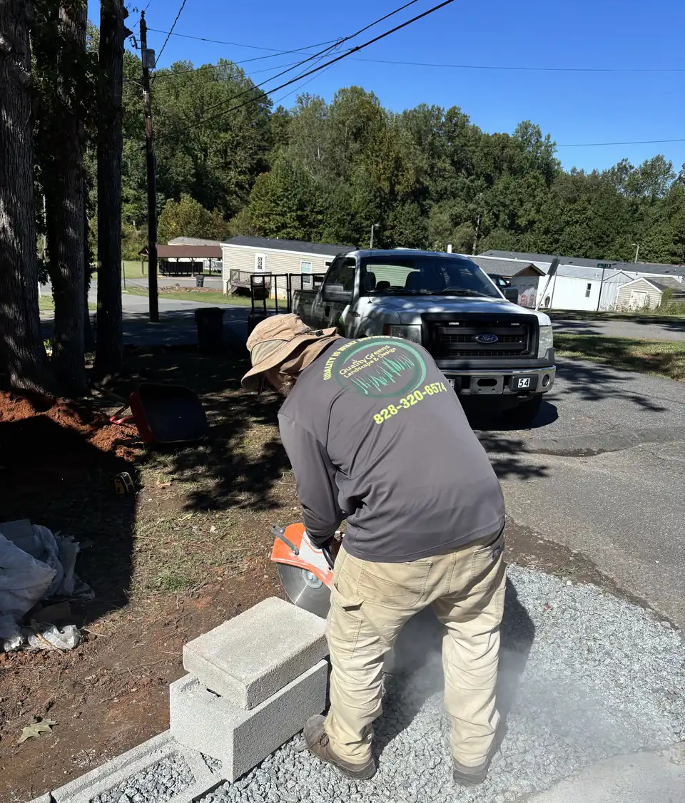 On the job: cutting cap block for a driveway wall